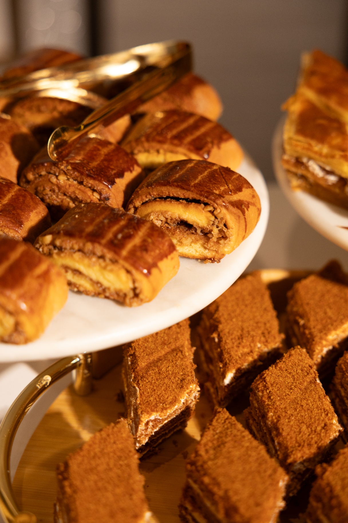 Armenian gata pastries and honey cake slices on tiered stands