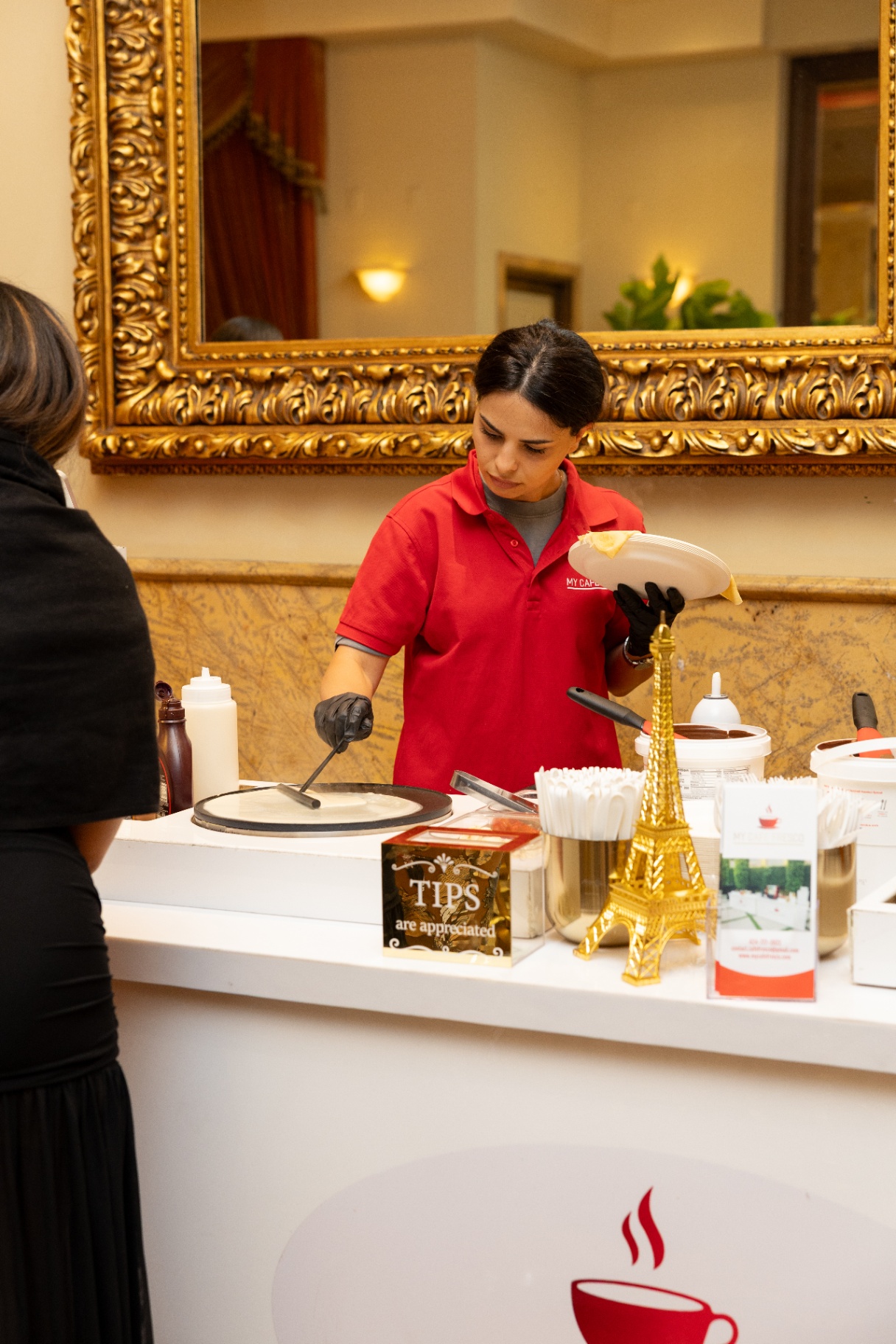 My Cafe Fresco crepe station under a gilded mirror at an elegant venue