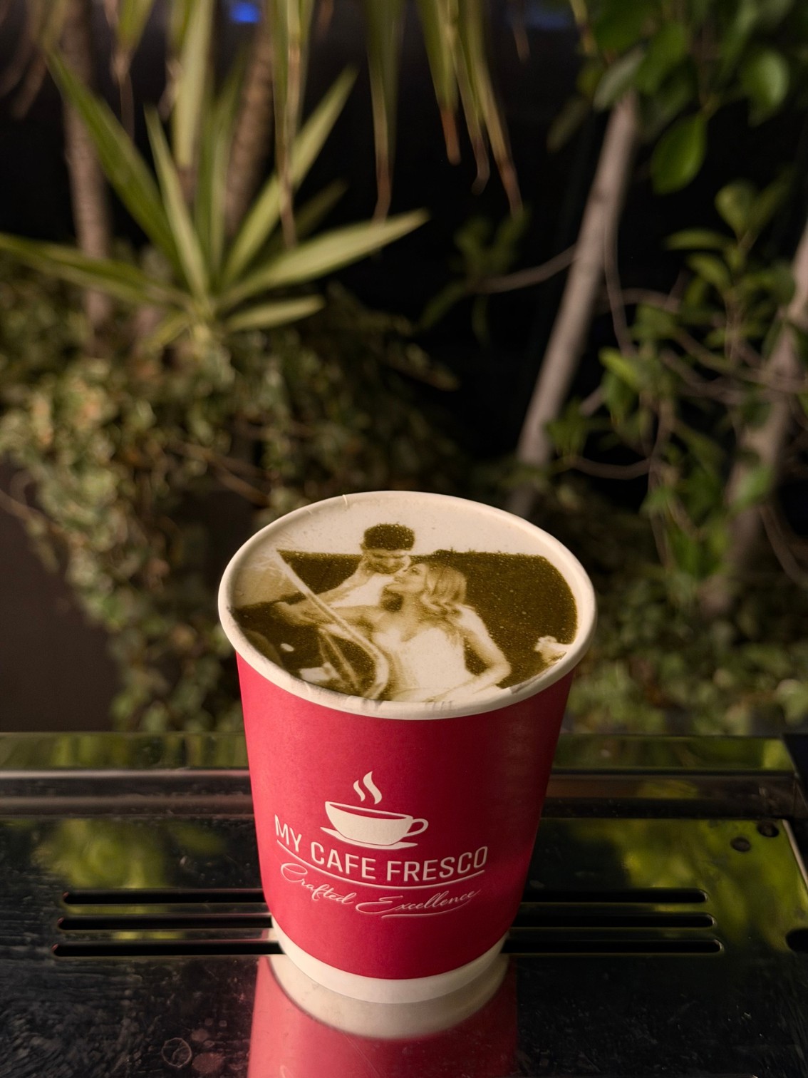 Custom photo latte art of a couple on a My Cafe Fresco cappuccino